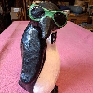 Vintage collectable paper mache penguin with sunglasses.